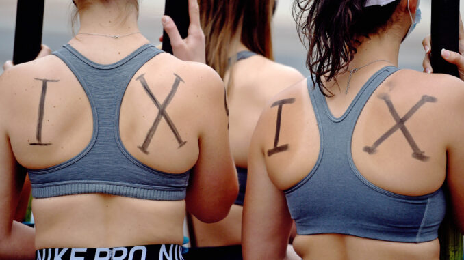 MEMBERS OF UCONN ROWING TEAM SUPPORTING TITLE IX CHANGES (HARTFORD COURANT)